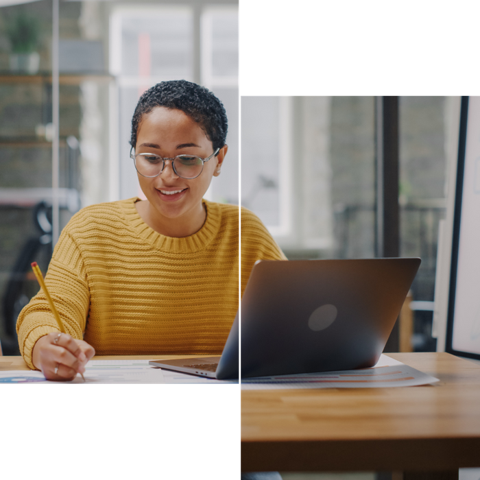 Young woman in office busy at her desk