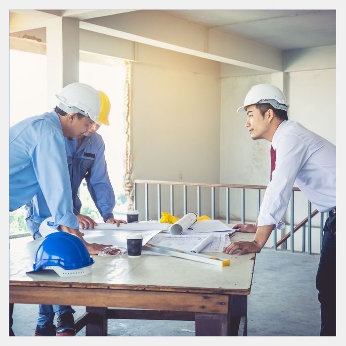 Construction workers discussing plans