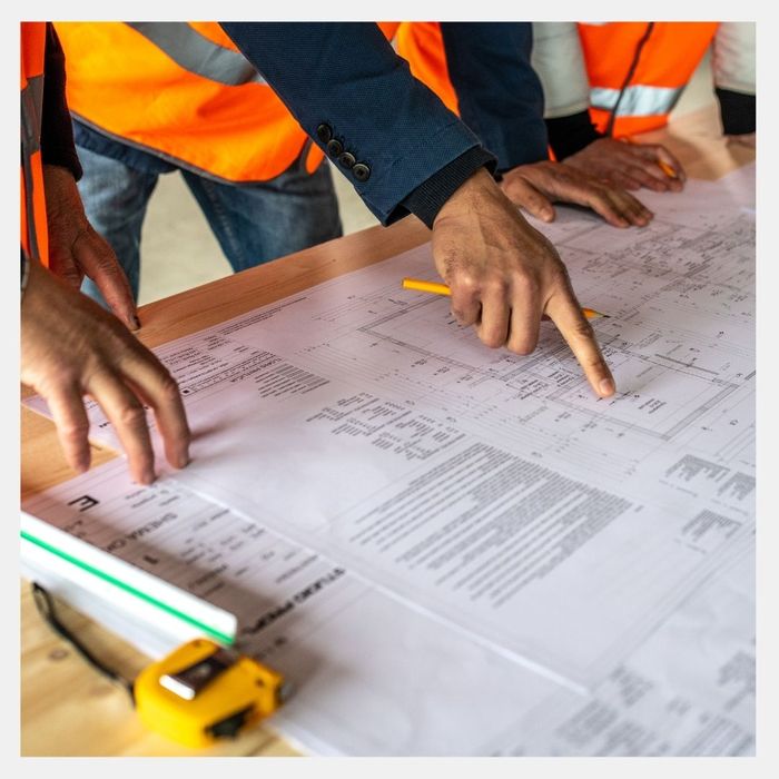 Construction workers going over a plan