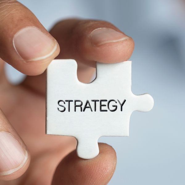 puzzle piece with strategy written on it