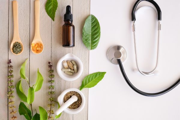 Variety of herbs near a stethoscope