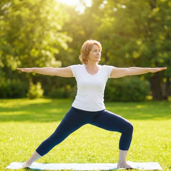 woman doing yoga in park