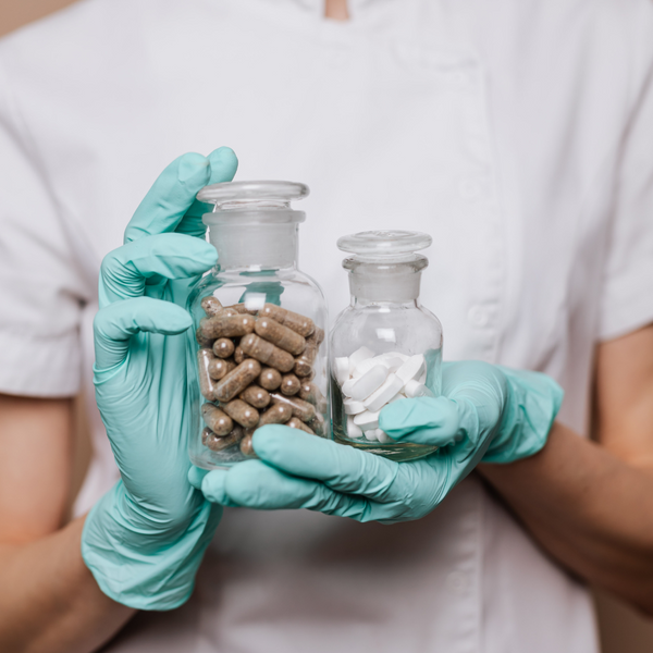 person holding two types of medication.