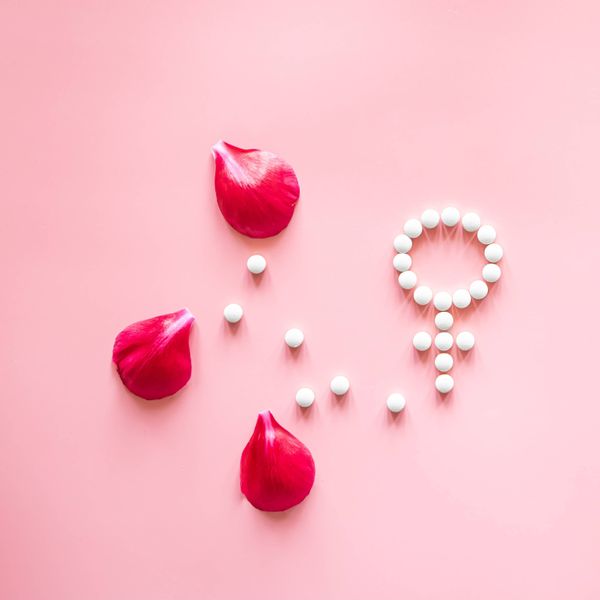 gender-venus-symbol-made-pills-peony-flower-petals-pink-background (1).jpg