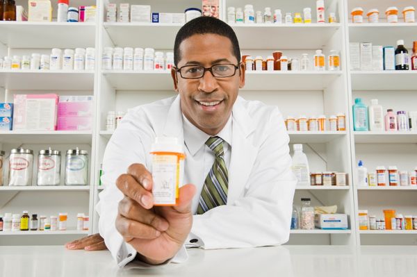 pharmacist_with_pill_bottle-scaled-2.jpg