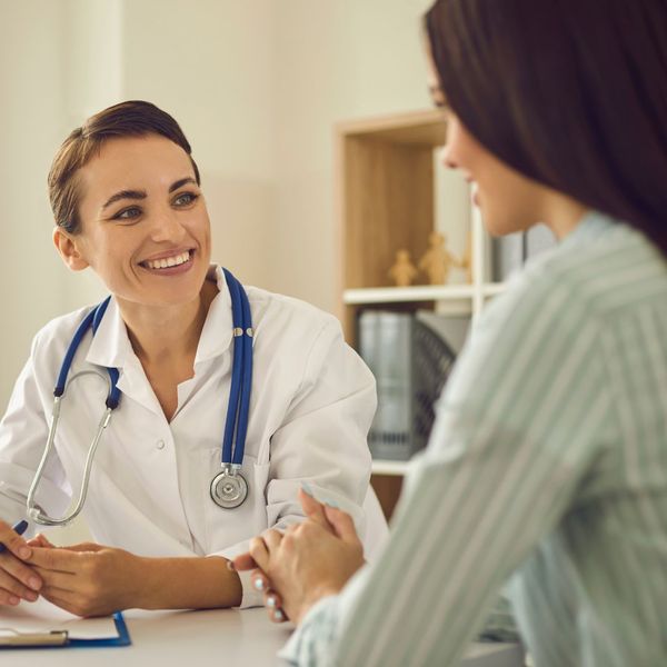 a doctor consulting with a woman How HRT Can Supercharge Your Fitness Goals.jpg