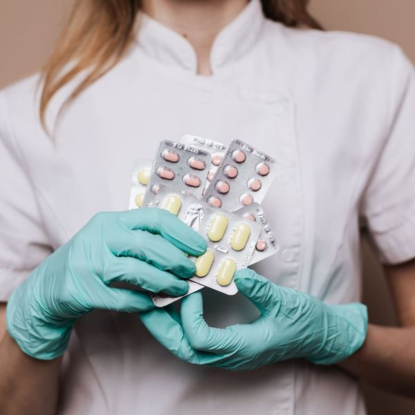 pharmacist holding medication