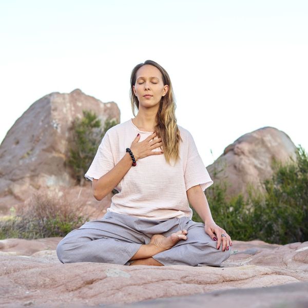 woman meditating outside