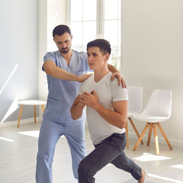 a physical therapist helping a client How HRT Can Supercharge Your Fitness Goals (4).jpg