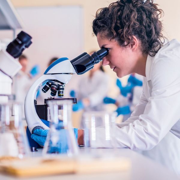 a scientist looking through a microscope Tips for Choosing Natural Supplements (2).jpg