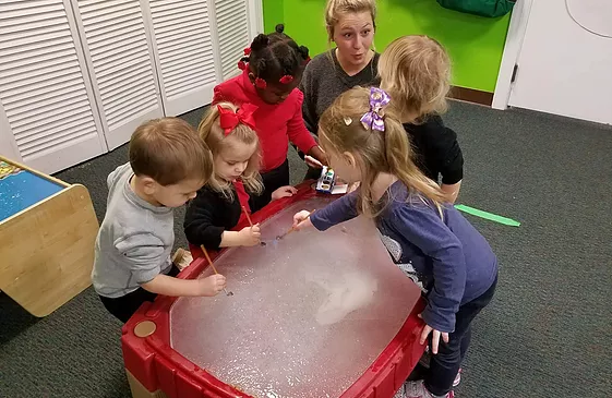 kids exploring a sensory table