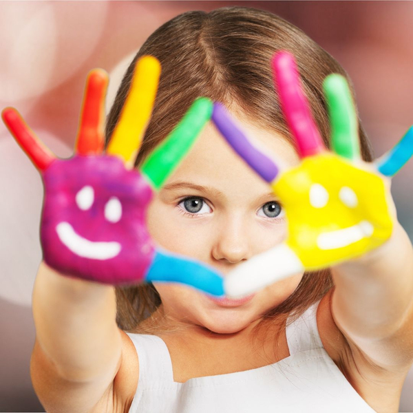 Young girl with painted palms and fingers