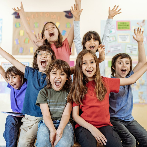 school age children smiling at camera