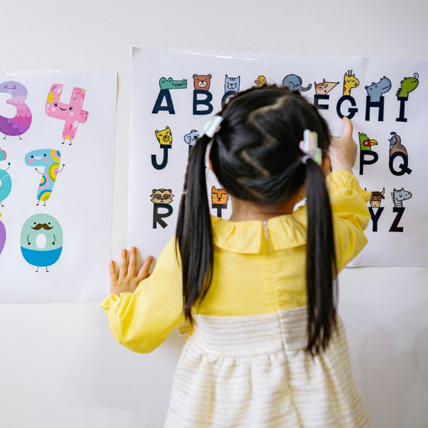 child looking at alphabet