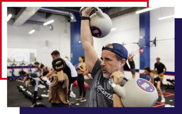 image of a man using kettle bells