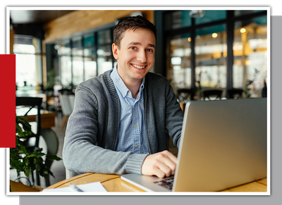 Image of a man on a laptop working