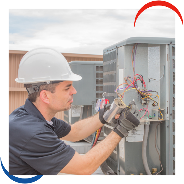tech working on hvac system tech working on hvac system
