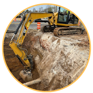 a bulldozer removing dirt from a hole