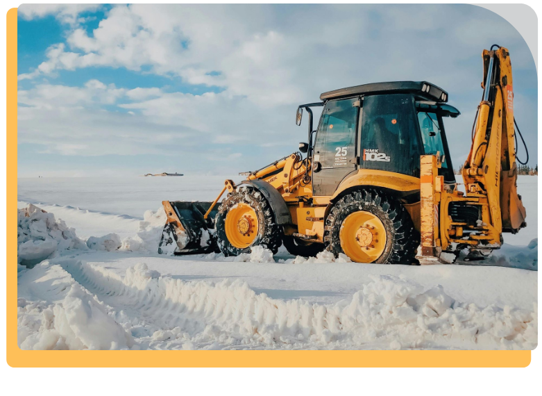 a bull dozer pushing snow away