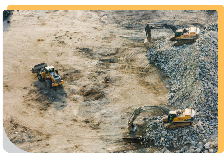 aerial view of bulldozers leveling and grading a site