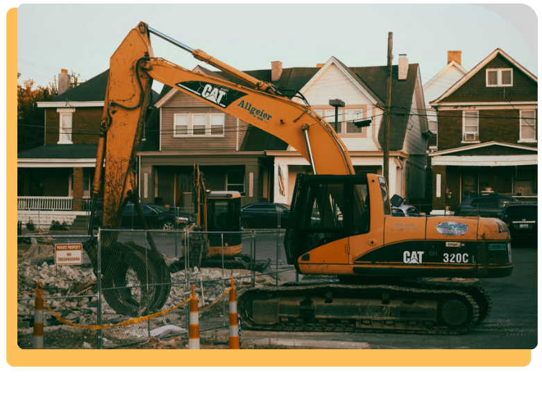bulldozer demolition of a building and surrounded by rubble