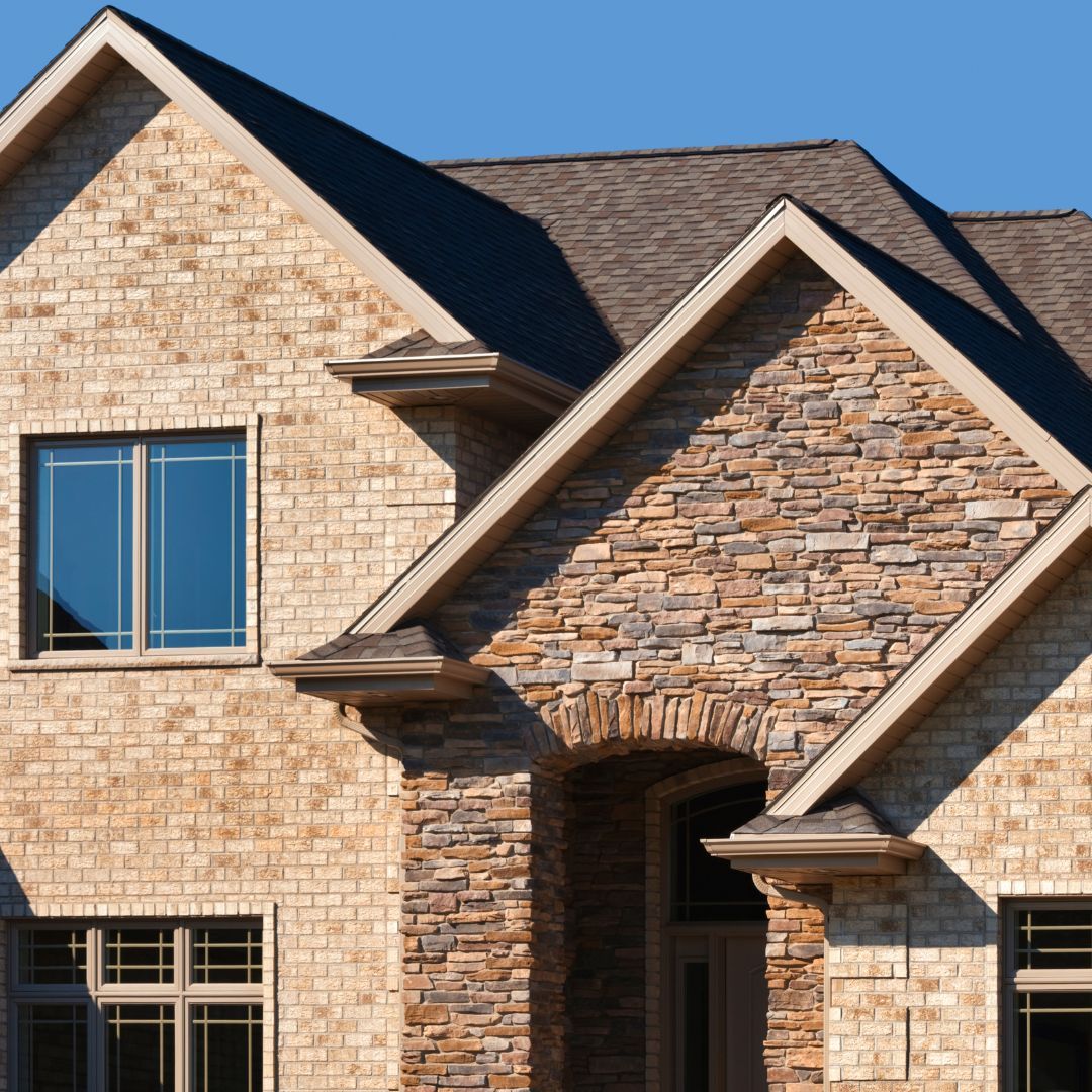 A brick home with a new roof