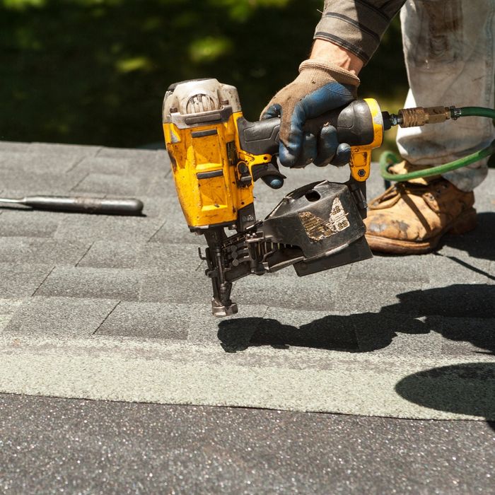 Image of a man roofing