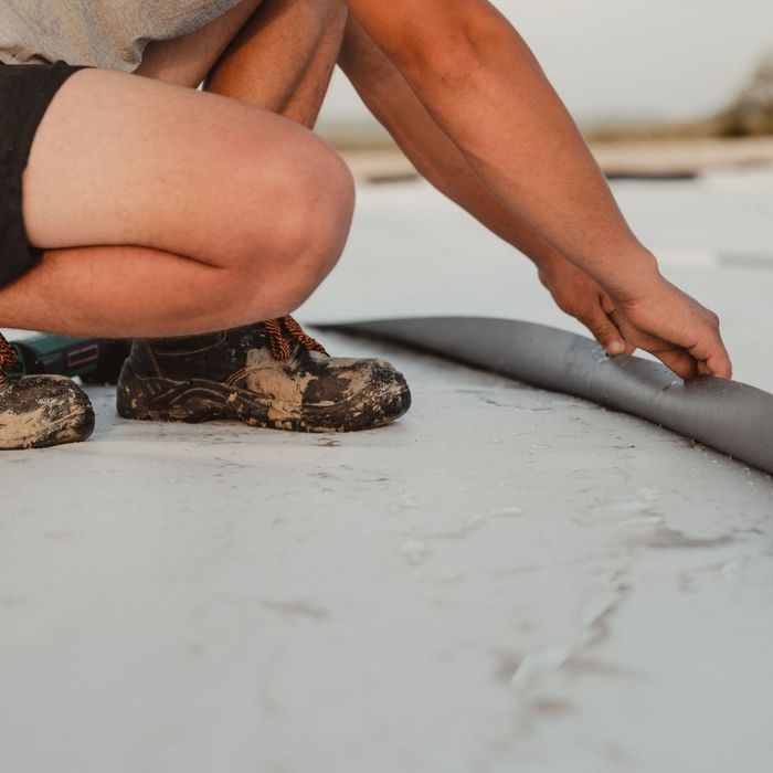 technician servicing flat roof
