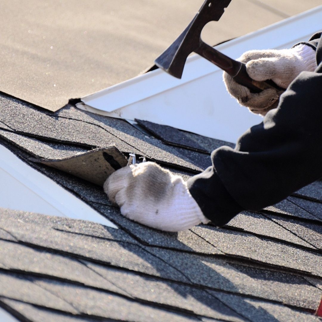 roofer repairing roof