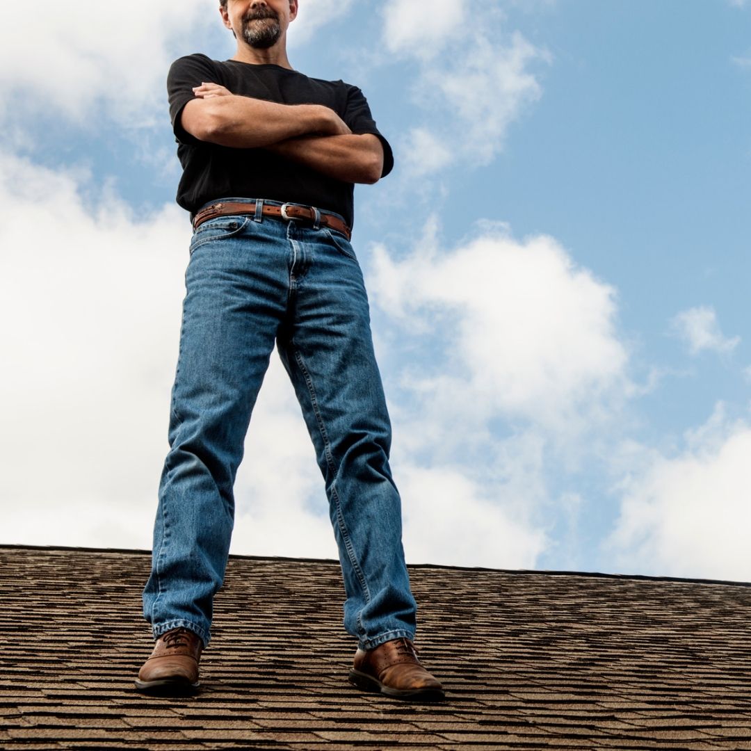 Image of a man roofing