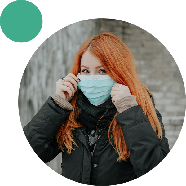 Red haired woman with surgical mask