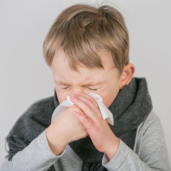 kid blowing nose