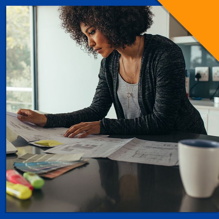 woman working at her desk with papers out