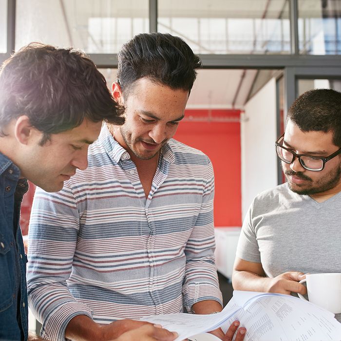 men looking over paperwork