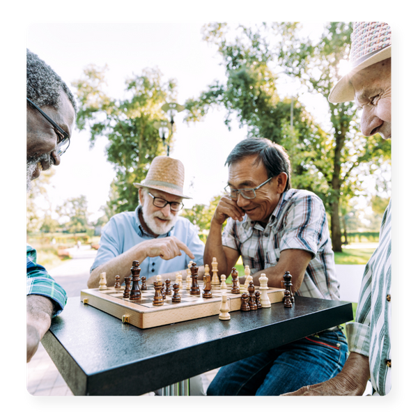 A group of seniors enjoying a game of chess