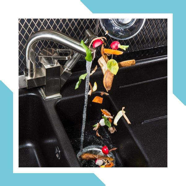 assortment of vegetables going into garbage disposal