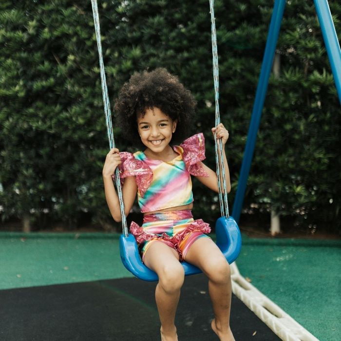 child on a playground swing