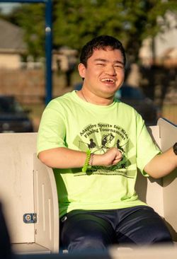 disabled boy playing on playground disabled boy playing on playground