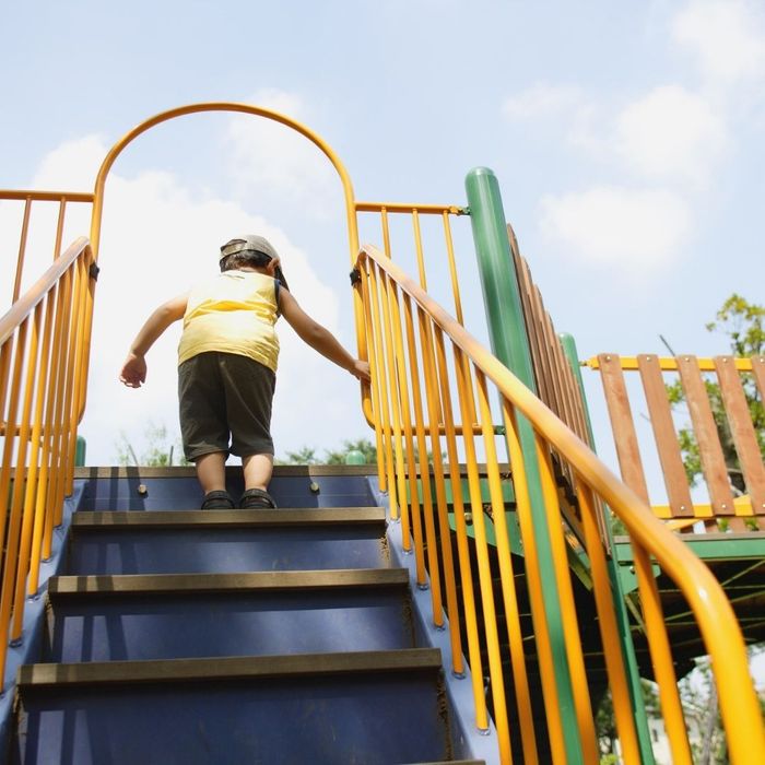 child climbing on a playground