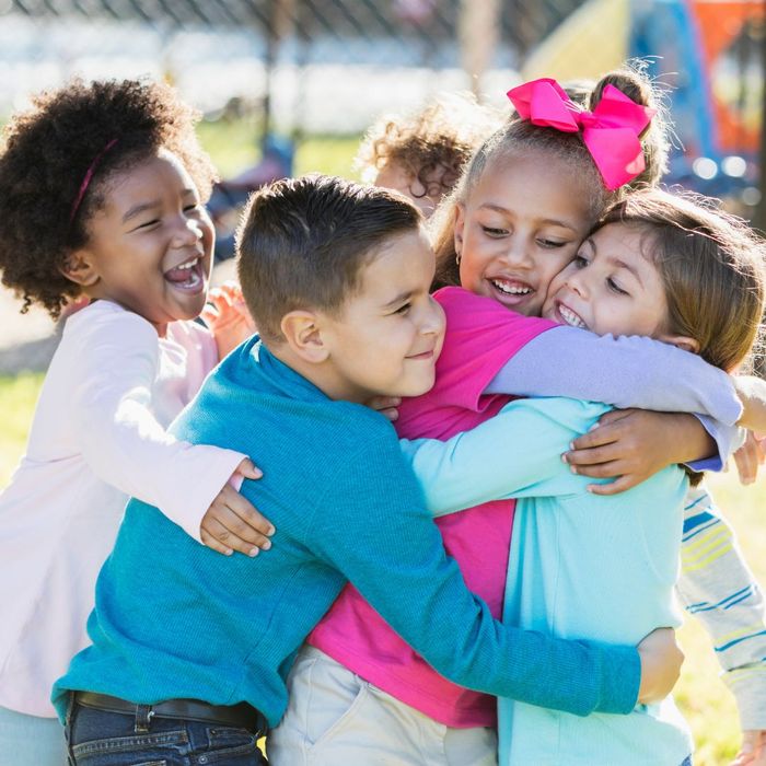 kids hugging on playground