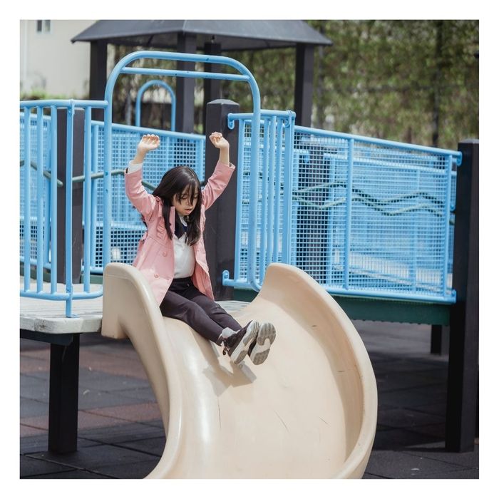 girl going down a slide