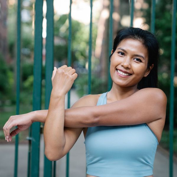 person stretching, getting ready to run