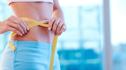 woman with measuring tape around waist