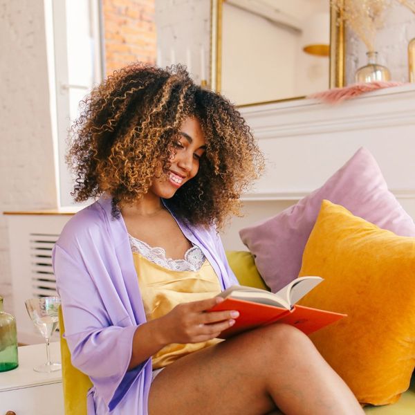woman reading a book after hair removal