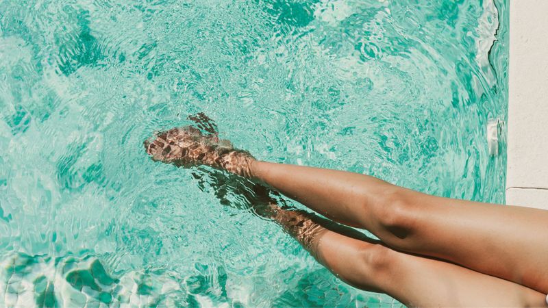 woman's legs in pool
