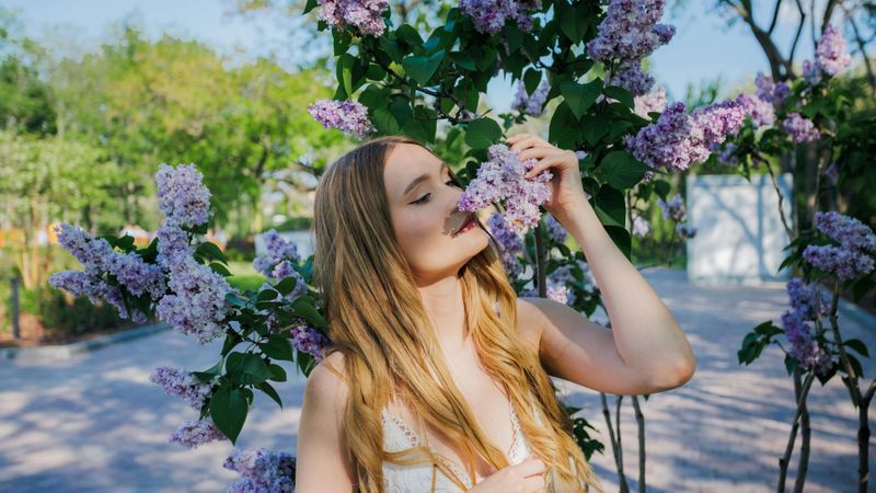 woman smelling flowers