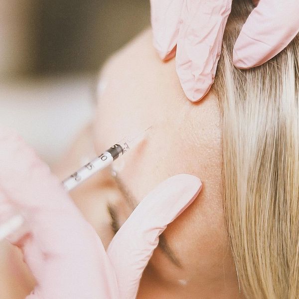 botox treatment in woman's forehead