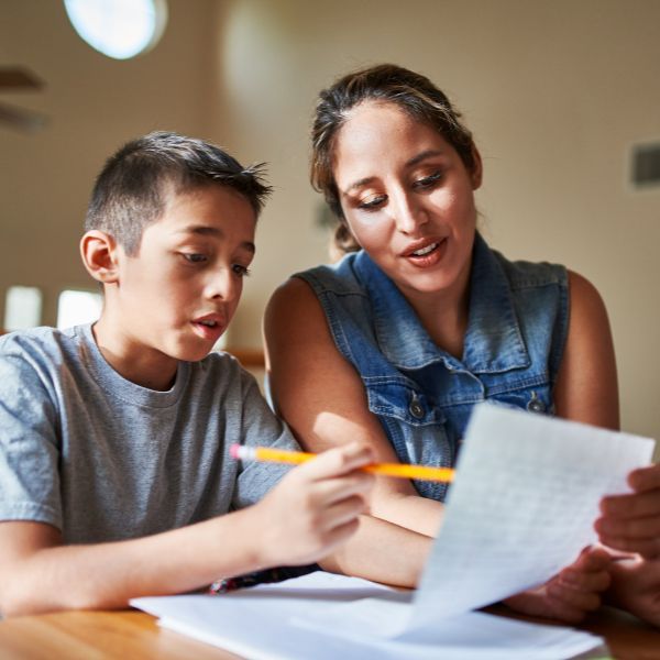 mother helping son with homework