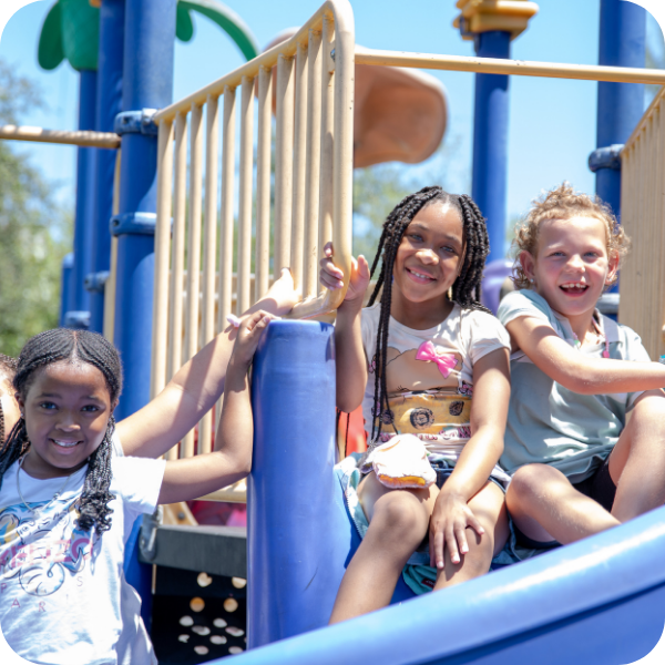 Kids smiling on a playground