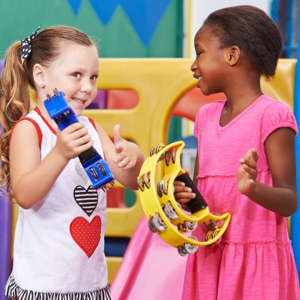 two children playing an instrument